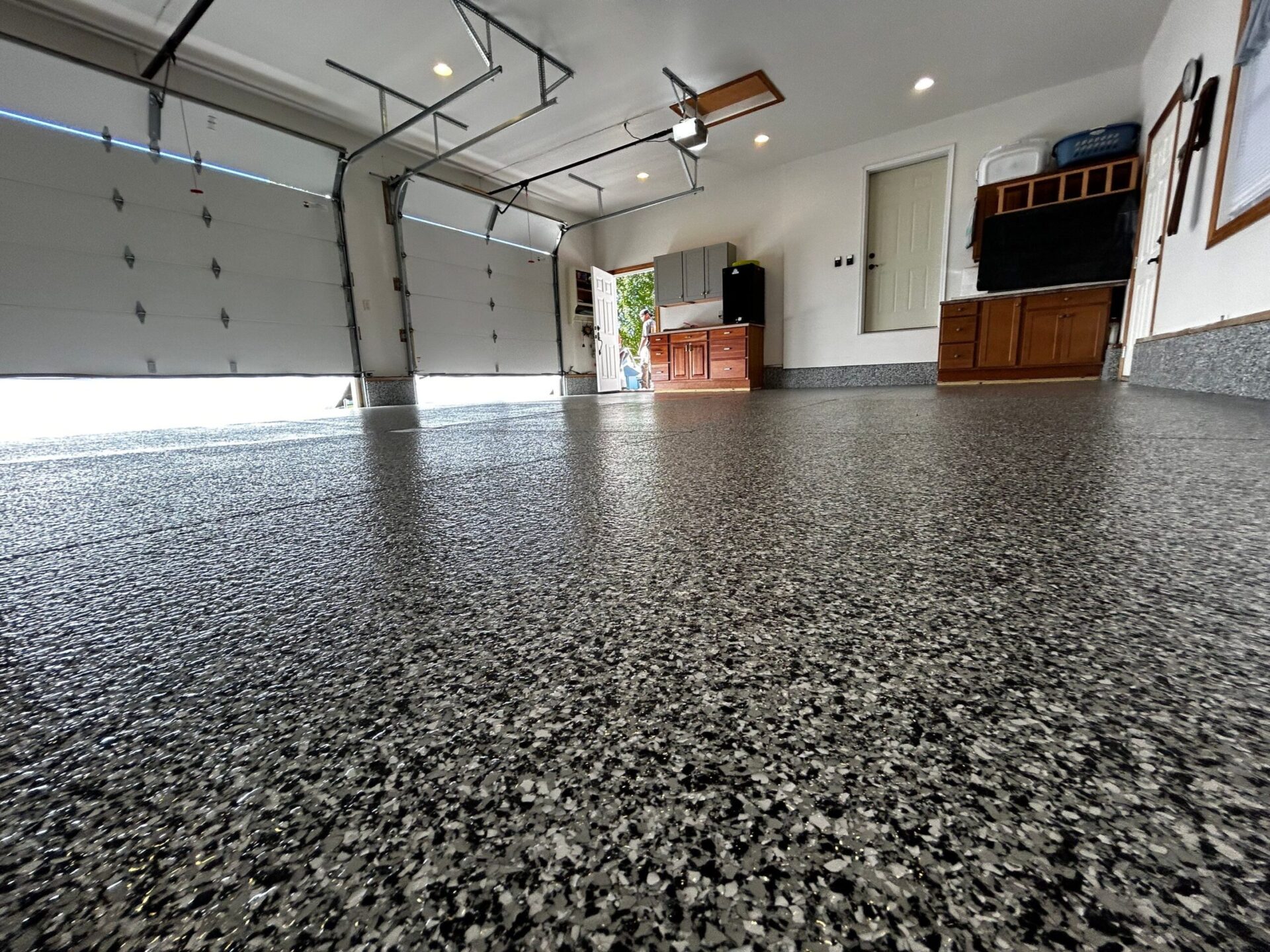 spring garage reset with epoxy flooring - professional surface restoration